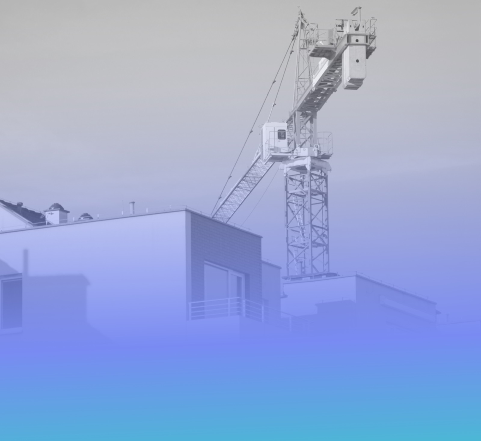 A tower crane over a residential building under construction